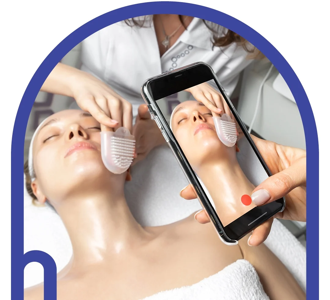 Graphic design of a person holding a phone over a woman getting asthetic care services